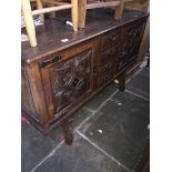 A Continental oak dining suite, comprising one dresser, dining table, 6 chairs and 2 carvers.