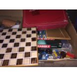 A box of games including Upstarts, and a world atlas Catalogue only, live bidding available via