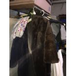 A faux fur coat and a silk scarf. Catalogue only, live bidding available via our website, if you