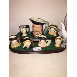 Royal Doulton Henry VIII and wives small character jugs on stand Catalogue only, live bidding