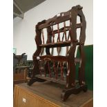 A magazine rack Catalogue only, live bidding available via our website, if you require P&P please