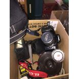 A box of misc accessories and a Canon EOS 1000F with lense and case, etc. Catalogue only, live