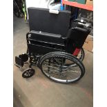 A folding wheelchair. Catalogue only, live bidding available via our website, if you require P&P