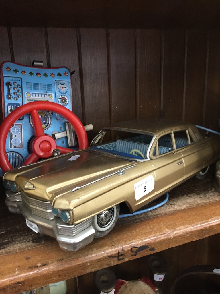 A vintage Bandai tin plate Cadillac with remote Catalogue only, live bidding available via our