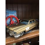 A vintage Bandai tin plate Cadillac with remote Catalogue only, live bidding available via our
