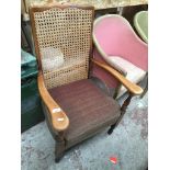 A bergere back armchair Catalogue only, live bidding available via our website, if you require P&P