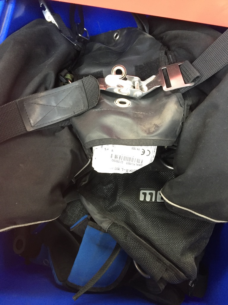 A box containing 2 diving jackets, Scubapro Rectex, Morphos Twin and a diving weight belt with