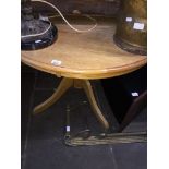 A light oak round dining table Catalogue only, live bidding available via our website, if you