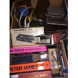 A box of misc including books, cameras, Sanyo cassette player, etc. Catalogue only, live bidding