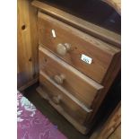 A pine three drawer bedside chest Catalogue only, live bidding available via our website, if you