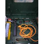 A Bosch electric hammer drill in case. Catalogue only, live bidding available via our website, if