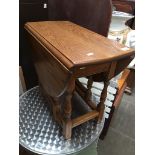 A small oak drop leaf occasional table Catalogue only, live bidding available via our website, if