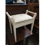 A white painted piano stool Catalogue only, live bidding available via our website, if you require