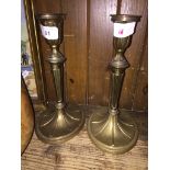 A pair of brass candle sticks. Catalogue only, live bidding available via our website, if you