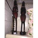 Two wooden tribal figures Catalogue only, live bidding available via our website, if you require P&P