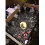 Black crate of glassware inc. decanters with plated labels and four Art Deco cocktail glasses