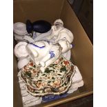 Box of pottery inc. pair of pot cats, blue and white platter etc. Catalogue only, live bidding