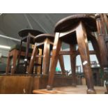A pair of oak stools, a teak stool and a two tier table Catalogue only, live bidding available via