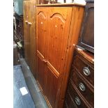 A pine wardrobe Catalogue only, live bidding available via our website, if you require P&P please