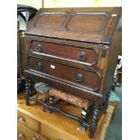 An oak bureau with geometric fronts Catalogue only, live bidding available via our website, if you