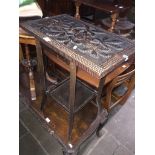 An oak side table with carved top. Catalogue only, live bidding available via our website, if you