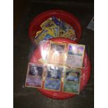 A tub of Pokemon cards. Catalogue only, live bidding available via our website, if you require P&P