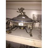 A Victorian silver plated entree dish with spirit burner, the cover with finial depicting a lion