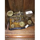 A set of postal scales with weights. Catalogue only, live bidding available via our website, if