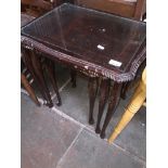 A glass top nest of tables Catalogue only, live bidding available via our website, if you require