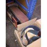 A belt sander + additional belts Catalogue only, live bidding available via our website, if you