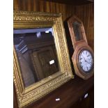 A drop dial wall clock with Seth Thomas signed dial together with a gilt framed mirror. Catalogue