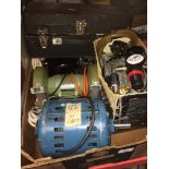 A box containing electric motors, mini air compressor, bench grinder and a wooden box with drill