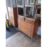 A suite of G-Plan retro bedroom furniture comprising a chest of drawers, a tall chest of drawers and