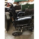 A folding wheelchair Please note, lots 1-1000 are not available for live bidding on the-saleroom.