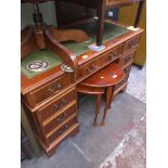 A reproduction pedestal desk with tooled green leather writing surface Please note, lots 1-1000