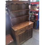 An oak priory style dresser with linen fold panels Please note, lots 1-1000 are not available for