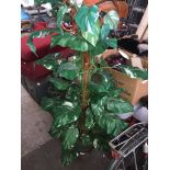 An artificial tree Please note, lots 1-1000 are not available for live bidding on the-saleroom.