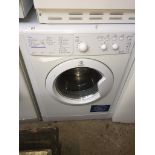 An Indesit washing machine Please note, lots 1-1000 are not available for live bidding on the-