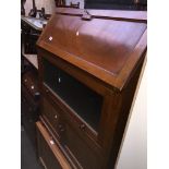 A bureau cabinet with lower fitted interior, middle glazed lift and slide cabinet with sailing boats