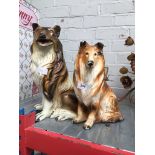 2 composite dog ornaments. Please note, lots 1-1000 are not available for live bidding on the-