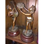 Pair of Edwardian spelter figures: 'Improvisateur Par Bruchon and L'Abondance by Par Buchon'