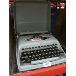 A Remington Envoy II portable typerwiter. Please note, lots 1-1000 are not available for live