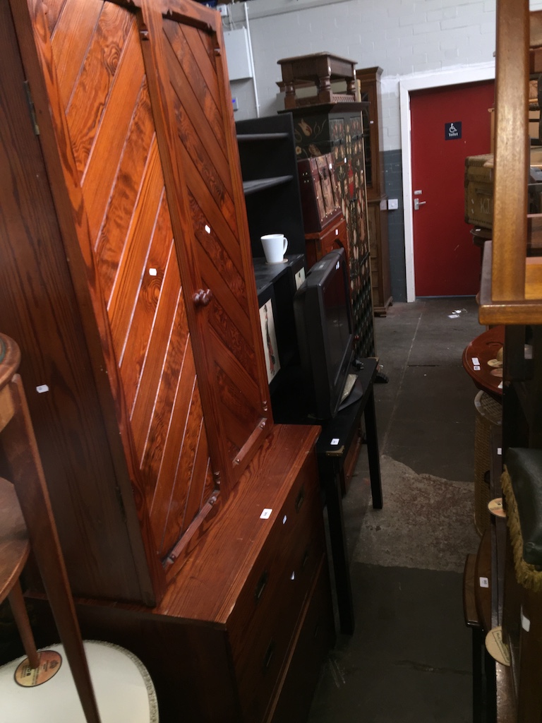 A pine dresser with cupboard top, together with a matching single cupboard Please note, lots 1-