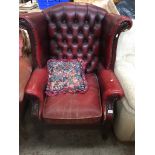 An oxblood leather chesterfield wing back armchair Please note, lots 1-1000 are not available for