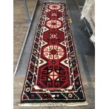 An Eastern style geometric runner, approx 71cm x 290cm. Please note, lots 1-1000 are not available