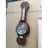 A wall hanging barometer. Please note, lots 1-1000 are not available for live bidding on the-