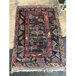 An eastern carpet, 180cm x 121cm. Please note, lots 1-1000 are not available for live bidding on