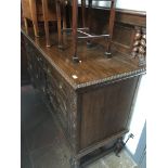 An oak sideboard with geometric panel fronts, rail back and gadrooned edge. Please note, lots 1-1000