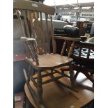 A beech rocking chair Please note, lots 1-1000 are not available for live bidding on the-saleroom.