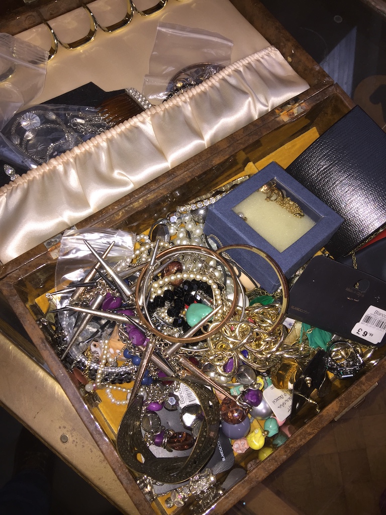 A vanity case with quantity of costume jewellery Please note, lots 1-1000 are not available for live